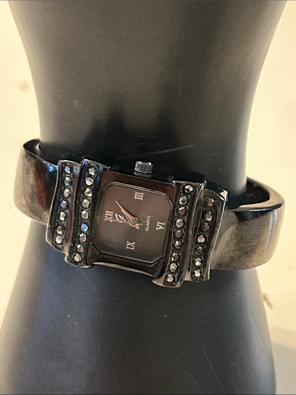 Geneva black analogue cuff watch w/rectangular face and rhinestone accents